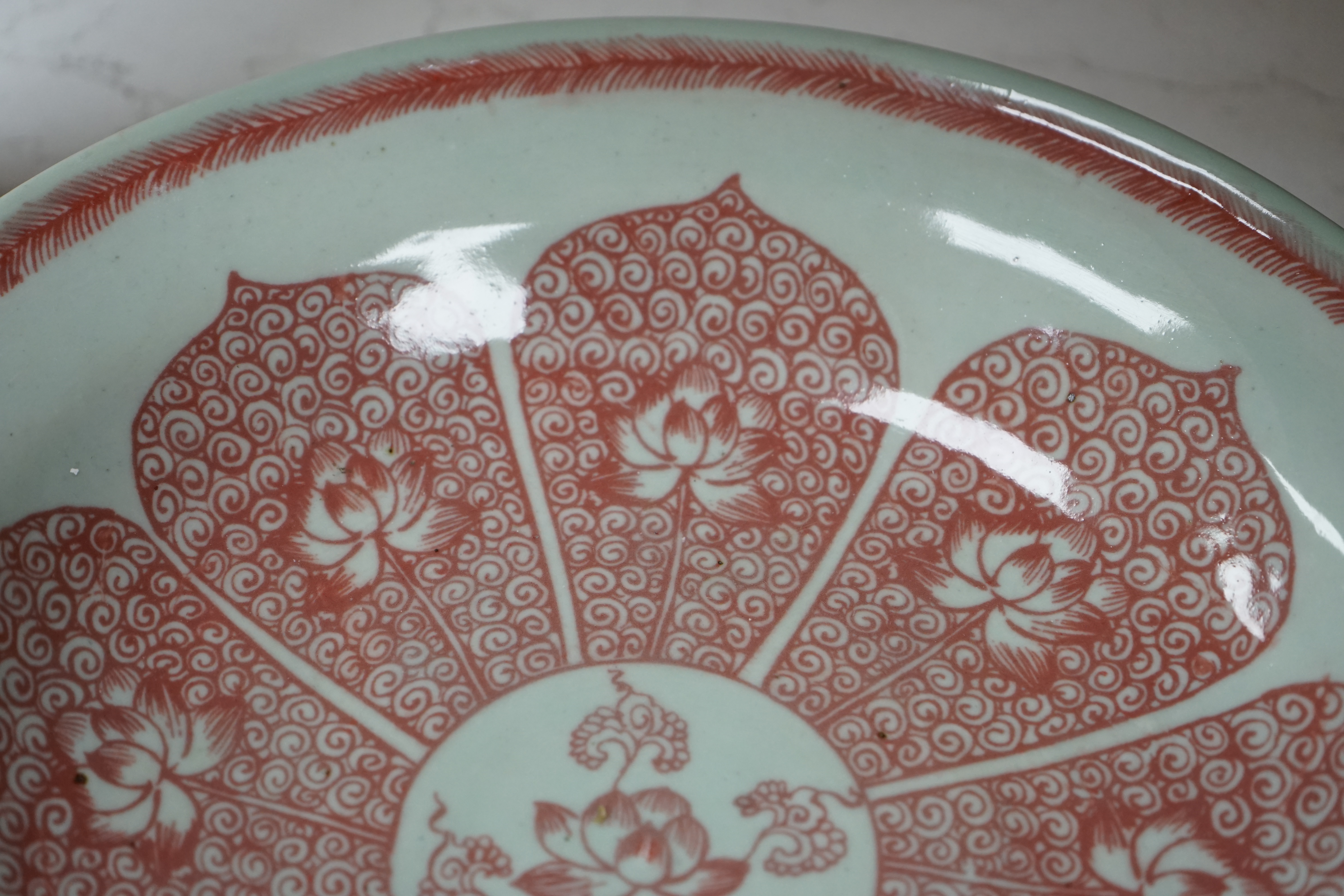 A Chinese underglaze copper red dish, 27cm diameter., Condition - good